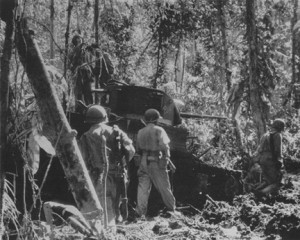 Marine light tank bogged down in jungle mud. So difficult was the terrain that the Marines had to give up using tanks.