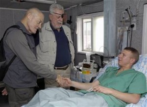 Colonel Howard, USA, and Colonel McGinty, USMC, Medal of Honor Recipients, visit a wounded soldier.