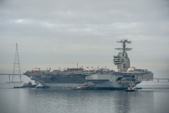131117-N-ZZ999-101 NORFOLK (Nov. 17, 2013) The aircraft carrier Pre-Commissioning Unit (PCU) Gerald R. Ford (CVN 78) is moved to Pier 3 at Newport News Shipbuilding. The ship will undergo additional outfitting and testing for the next 28 months. (U.S. Navy photo courtesy of Huntington Ingalls Industries by Chris Oxley/Released)