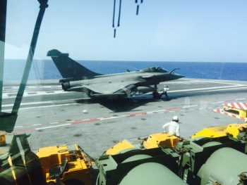 A Rafale fighter prepares to launch off the deck of the aircraft carrier FS Charles de Gaulle (R 91) on a strike mission against Da’esh. (Personal photo courtesy of Vice Adm. James Foggo III)