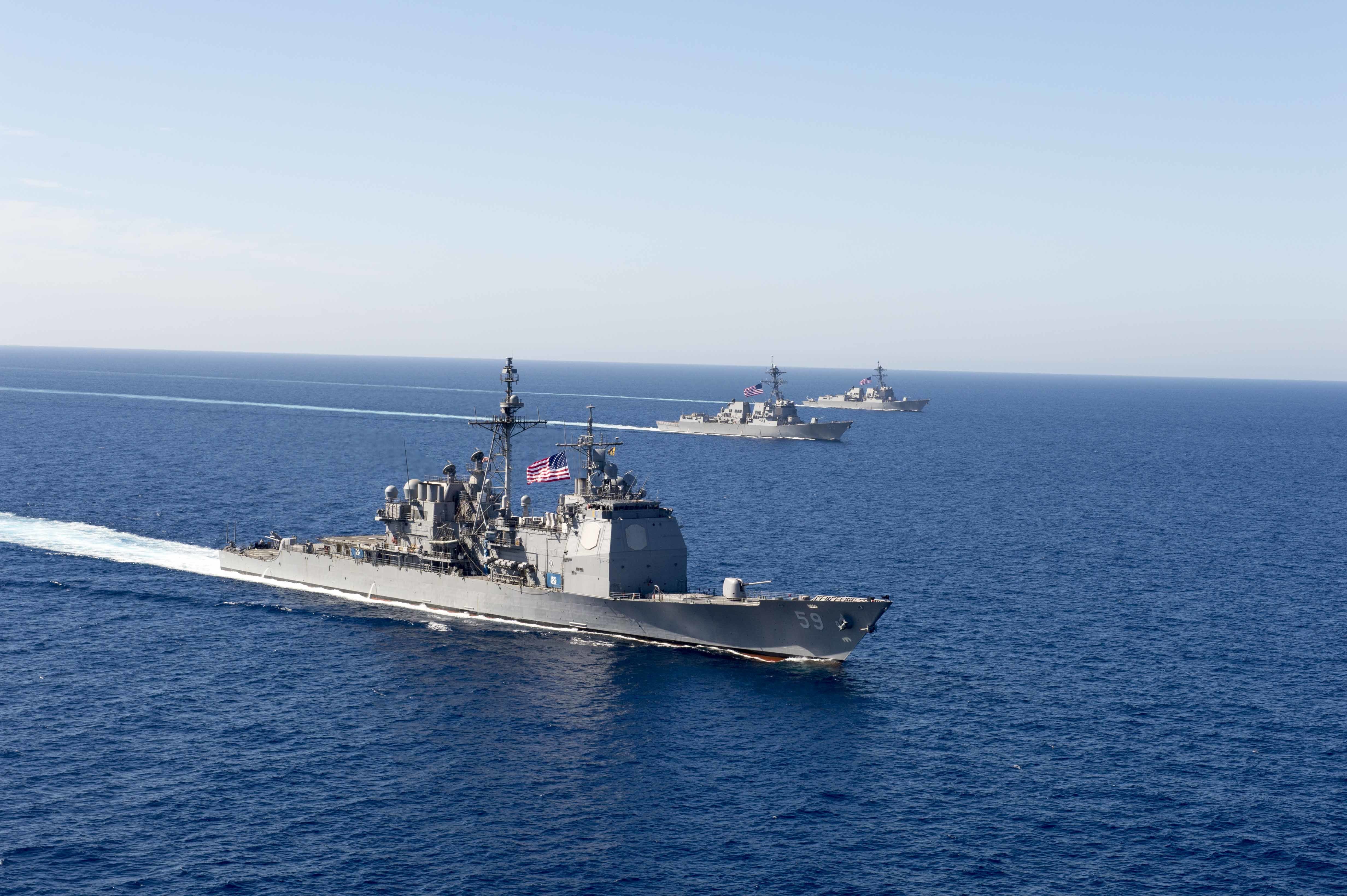 the USS Princeton (CG 59) steams in formation with ships from USS Nimitz Carrier Strike Group during an exercise in the Southern California operating area Oct. 10, 2016. Thirteen warfare tactics instructors are underway with USS Nimitz Carrier Strike Group leading the Surface Warfare Advanced Tactical Training (SWATT). SWATT is a three-week exercise to tactically prepare cruisers and destroyers for carrier strike group integration. The Naval Surface and Mine Warfighting Development Center opened June 9, 2015, at Naval Base San Diego and is responsible for increasing the tactical proficiency of the Navy's surface warfare community through the creation of warfare doctrine, underway advanced-training exercises and warfare tactics instructors. (U.S. Navy Combat Camera photo by Petty Officer 1st Class Trevor Andersen/Released)